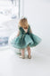 Stefania Girl Glitter Dress In Emerald Green With Open Back